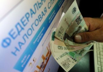 Путин призвал освободить россиян от просроченной задолженности по налогам