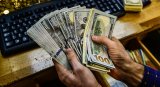 Сколько денег казахстанцы перевели за рубеж
