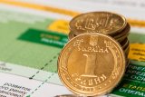 Официальный курс гривны установлен на уровне 27,67 грн/доллар