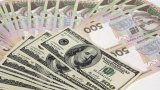 Гривня на міжбанку росте, НБУ купує валюту